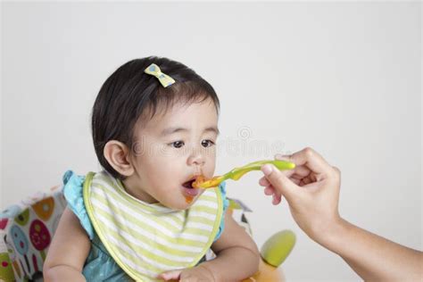 Chinese Baby Girl Eating Food With Chopsticks Stock Photo Image Of