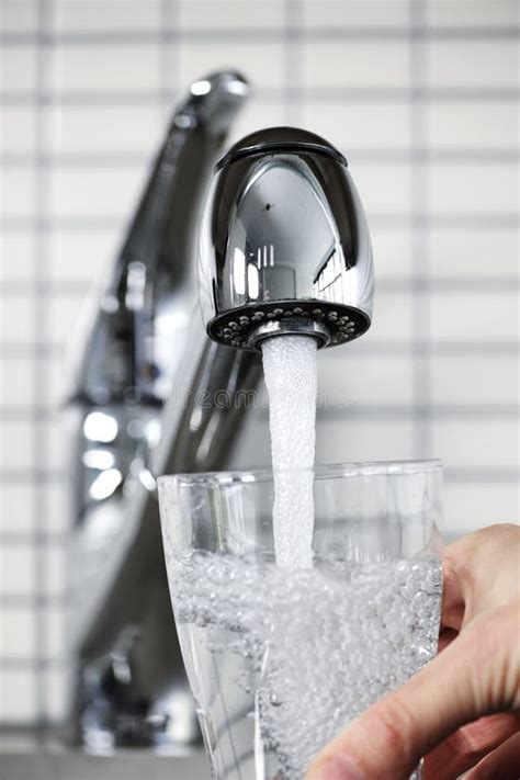 Filling glass of tap water stock image. Image of bubbles - 14668931