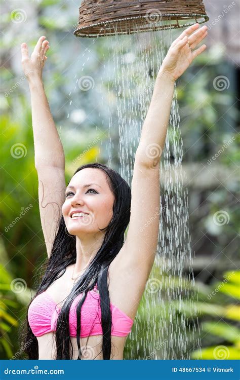 Woman With Long Hair In Bikini Under The Shower On Tropical Beach Stock