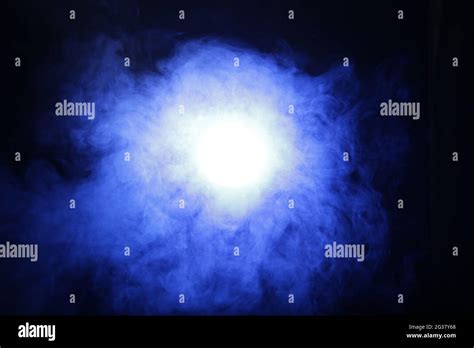 Smoke In Blue Light On Black Background Stock Photo Alamy