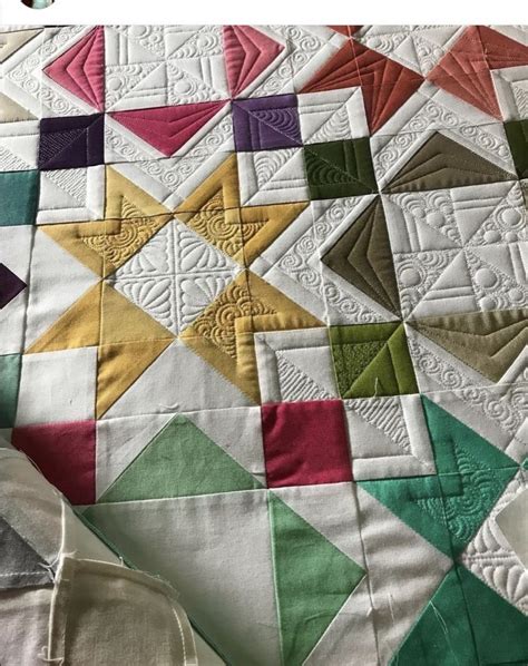 An Image Of A Quilt Made With Different Colors