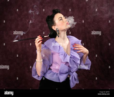 Woman Smoking Cigarette Holder Stock Photos And Woman Smoking Cigarette