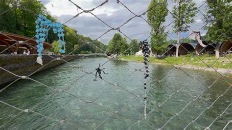 Rosaries Hang On The Railing Of The Bridge In Lourdes Stock Footage