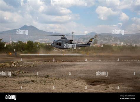 A Honduran Uh 1h Huey Lands On A Helicopter Landing Zone In Tegucigalpa