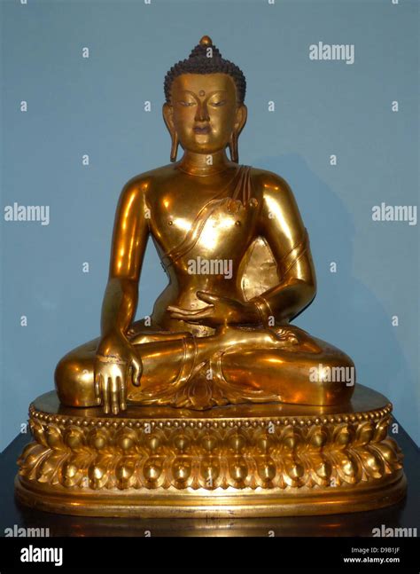 Seated Buddha 1740-86, China, Gilded copper. The Buddha is shown just ...