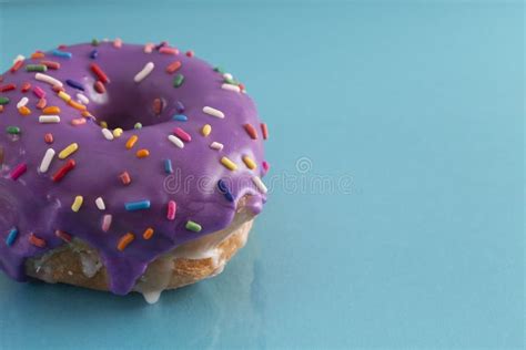 Purple Glazed Donut with Rainbow Sprinkles on Top Stock Photo - Image of dessert, frosting ...