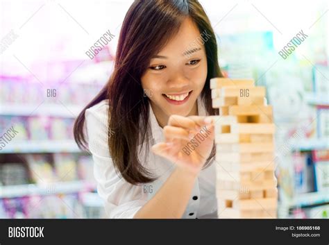 Asian Lady Play Jenga Image And Photo Free Trial Bigstock