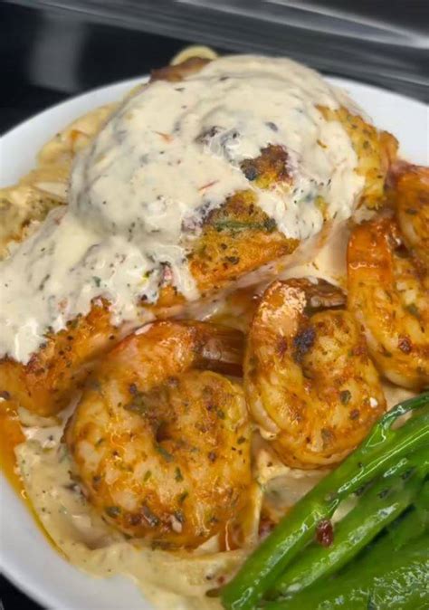 Crab Stuffed Salmon And Shrimp Over Fettuccine Alfredo Pasta And