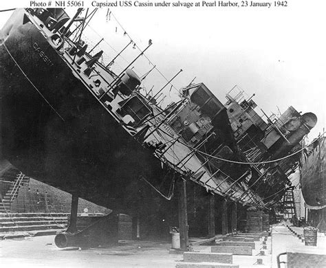 An Old Black And White Photo Of A Large Ship In Dry Dock With Stairs