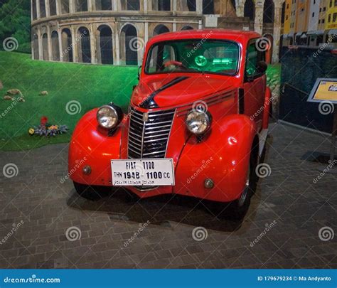 An Ancient Fiat 1100 Red Car Parked Inside The Angkut Museum At Night. Editorial Image ...