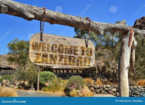 Vintage Wood Signboard With Text Welcome To Zanzibar Hanging On A