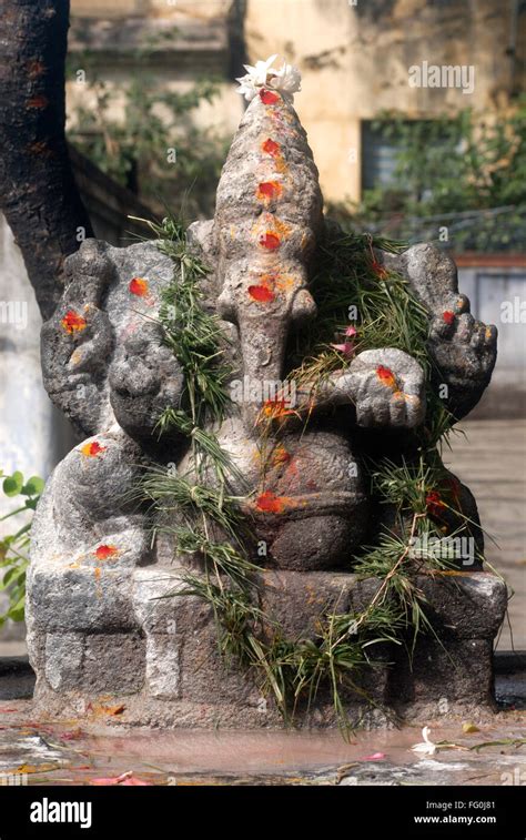 statue  lord ganesh ganpati  garland  durva grass  shree