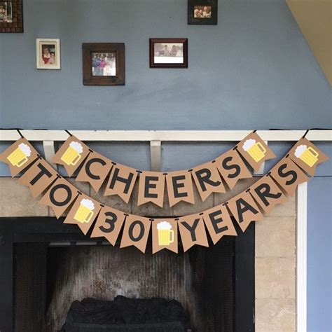 A Fireplace With A Banner That Says Cheers To Years