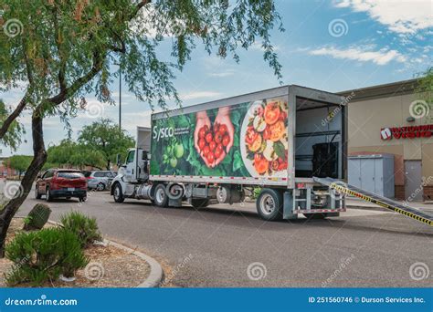 Sysco Delivery Truck Leaves Parking Lot After Delivering Products