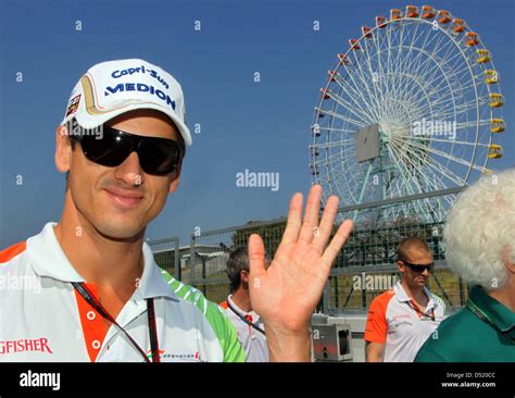 German Driver Adrian Sutil Of Force India Arrives In The Paddock Of