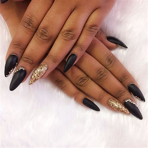 Stiletto Nails In Matte Black With Gold Glitter And Swarovskis Black