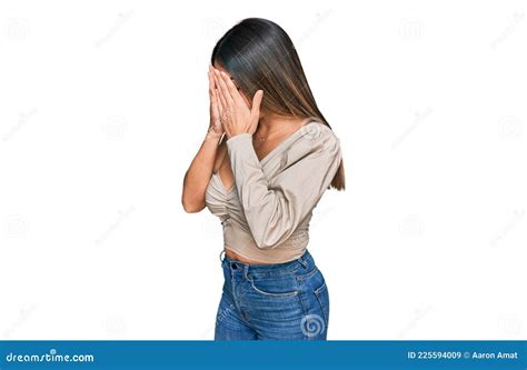 Young Hispanic Woman Wearing Casual Clothes With Sad Expression