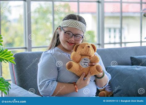 Portrait Close Up Shot Of Asian Young Happy Chubby Down Syndrome