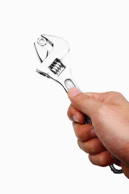 Premium Photo Close Up Of Hand Holding Work Tool Over White Background