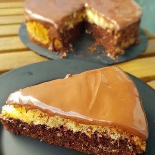 Two Pieces Of Chocolate Cake On Plates With One Slice Missing From The