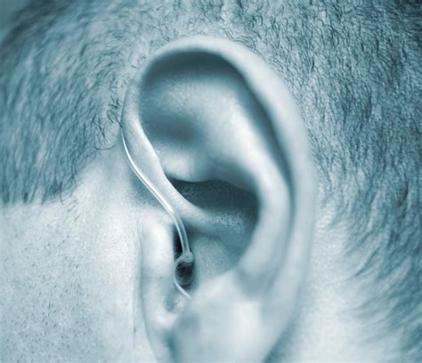 Premium Photo Close Up Of Man Wearing Hearing Aid