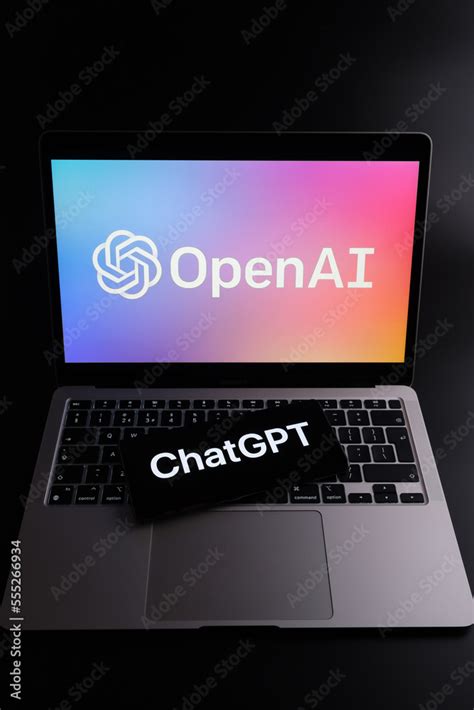 Chatgpt Logo Seen On Smartphone And Laptop Display With Blurred Openai