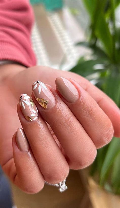 Your Nails Deserve These Floral Designs Gold Foil White Flower Nude Nails Simple Nails