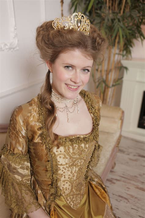 Kinky Queen With Big Tits Poses Naked With Her Servants On A Couch