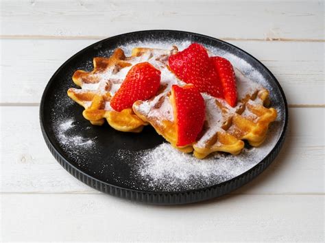 Premium Photo Freshly Baked Belgian Viennese Waffles Sprinkled With