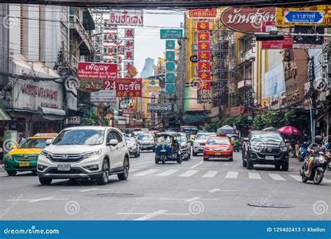 Traffic On Yaowarat Road With Billboard Signs In The Chinatown District