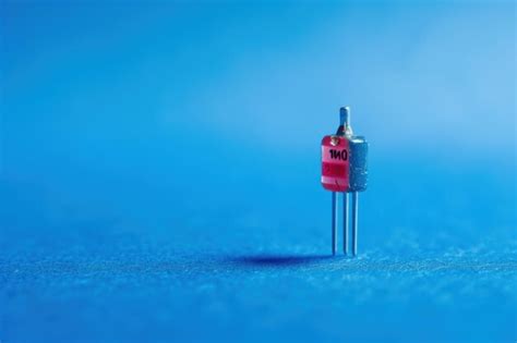 Small Electronic Component On A Blue Background Premium Ai Generated Image