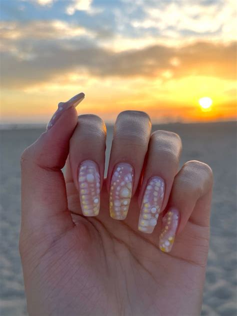 Yellow And White Blooming Gel Nails With Pearls And Bubble Texture Dots