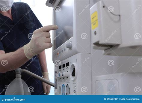 The Anesthesiologist Turns On The Machine For Artificial Ventilation Of