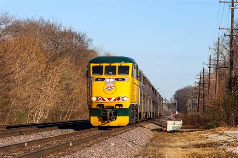 The yellow and green machine leads an outbound train : r/trains