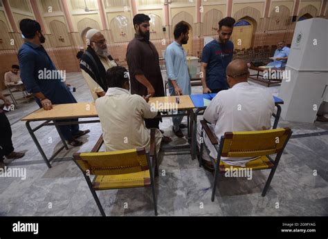 A Man Casting The Ballot For Azad Kashmir Election People Stand