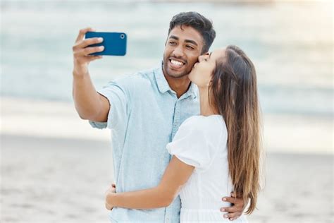 Premium Photo Travel Vacation And Selfie By Couple Kiss On A Beach