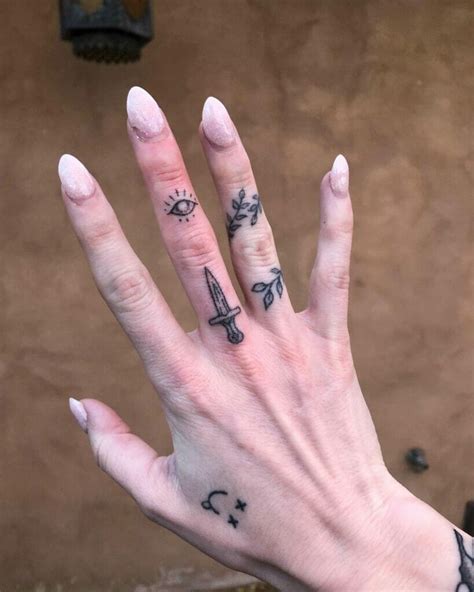 Evil Eye Finger Tattoo