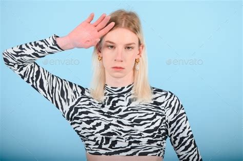 Youth Transgender Lgbt Looking At Camera While Posing Isolated Over Nude Color Background Stock