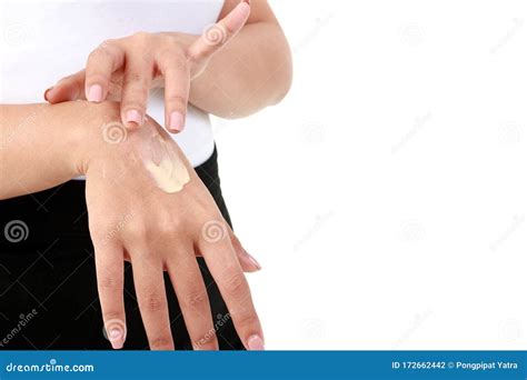 Young Women Apply Nourishing Cream To The Back Of The Hand To