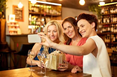 Premium Photo Women With T Taking Selfie At Wine Bar