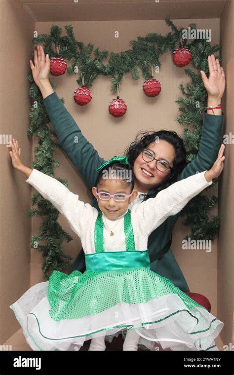 Single Mom With Her 5 Year Old Brunette Latina Daughter With Eyeglasses Inside A Decorated Gift