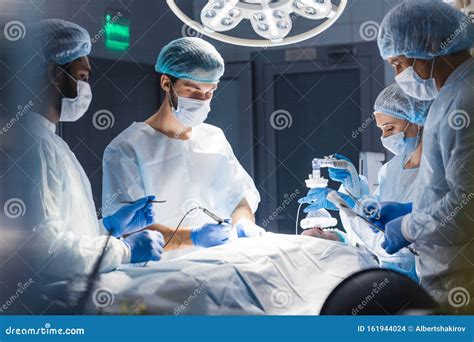 Blurred Background With Team Surgeon At Work In Operating Room Stock