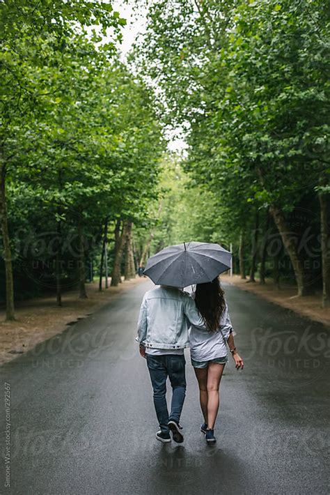 Couple Walking Together Under The Rain By Gic Rain Couple Stocksy United