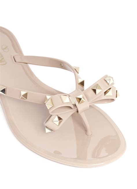 Lyst - Valentino Rockstud Bow Flat Jelly Sandals in Natural