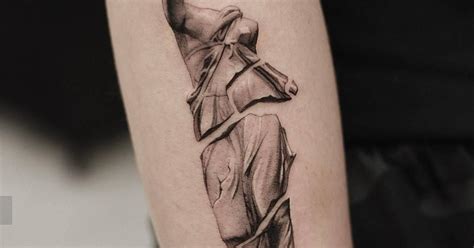 Broken Sculpture Tattoo Located On The Forearm