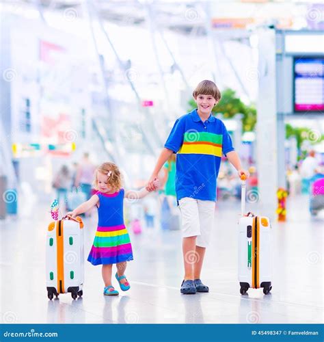 Children at the airport stock image. Image of departure - 45498347
