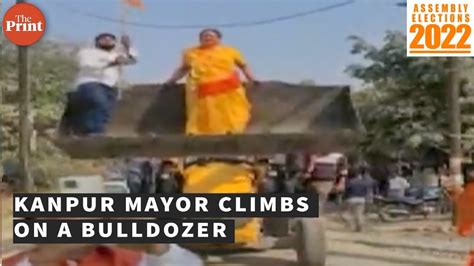 Kanpur Mayor Climbs On A Bulldozer To Celebrate Bjps Up Win Youtube