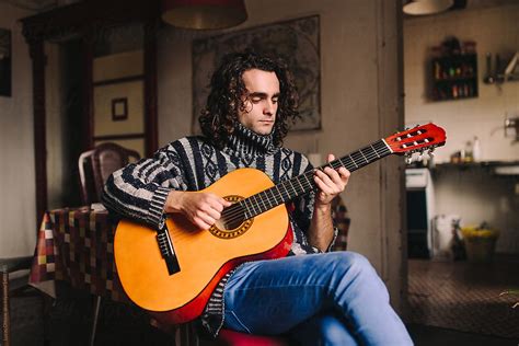 "Young Bohemian Man Playing Acoustic Guitar" by Stocksy Contributor ...