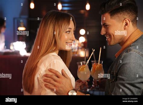 Man And Woman Flirting With Each Other In Bar Stock Photo Alamy