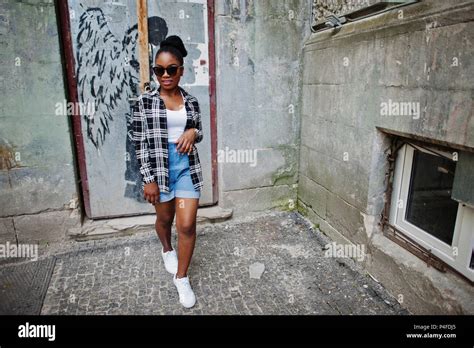 Hip hop african american girl on sunglasses and jeans shorts. Casual ...